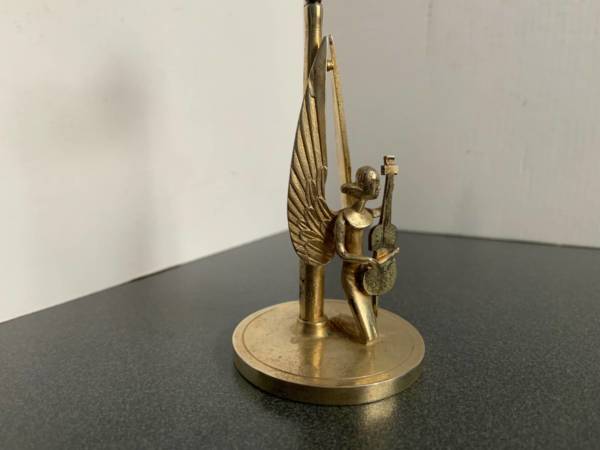 Silver gilt Candlestick from the Chapel of Angels - cello player by Herbert zeitner, Lueneburg, Germany