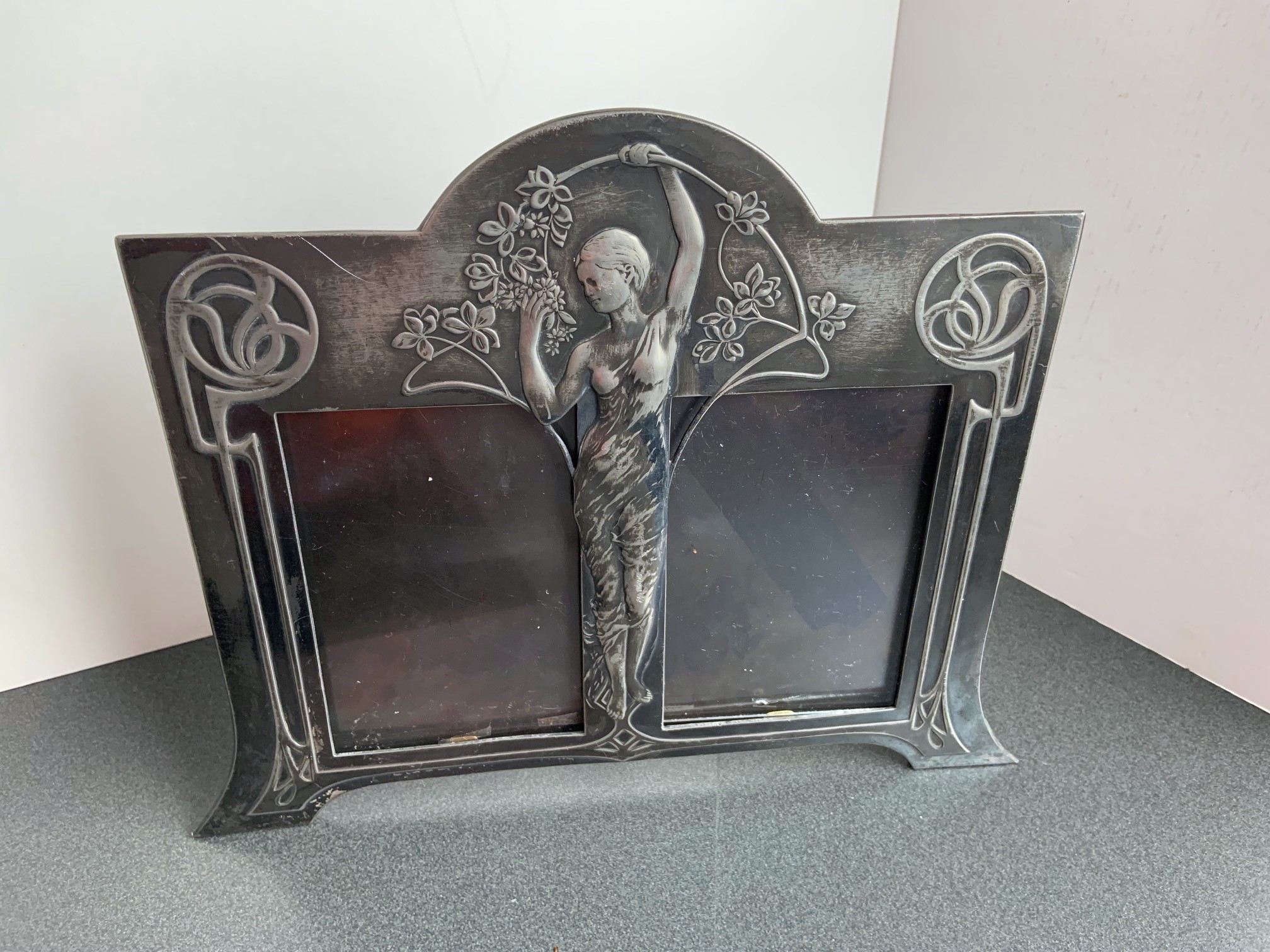 German Art Nouveau photo stand frame, c. 1900, WMF company mark, Geislingen, plated, double frame with ornamental and figural decoration, silver plating rubbed