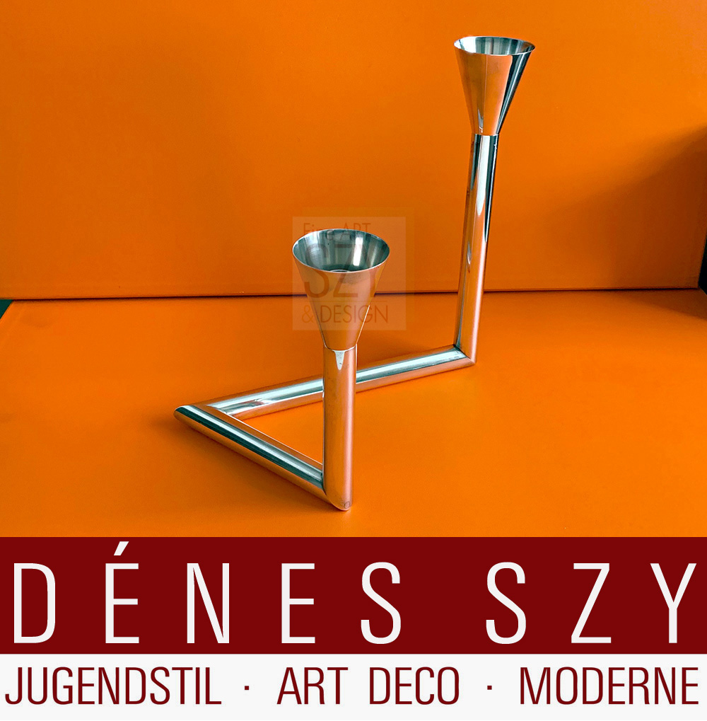 Table candleholder, candlestick, two-flame candelabra with torch-shaped spouts.