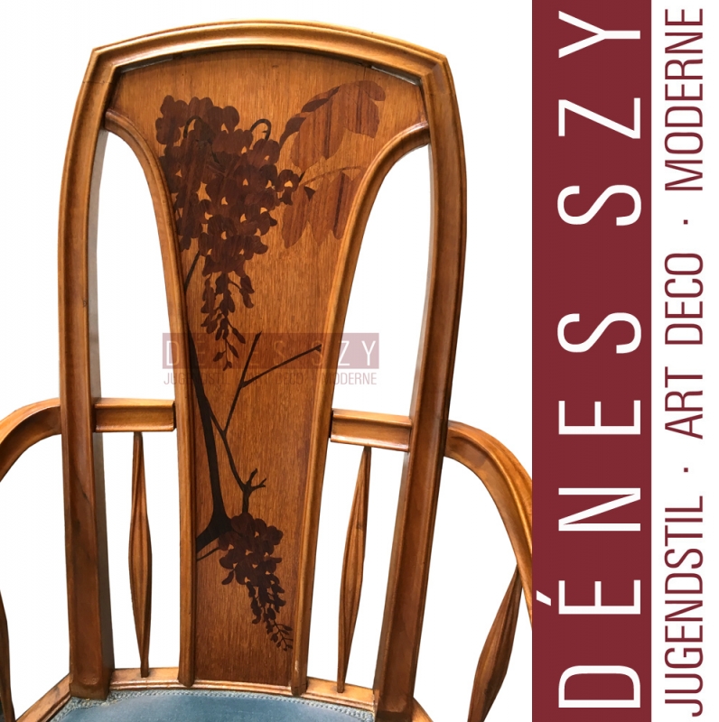 Louis Majorelle, Mahogany, nutwood and fruitwood, polished and with inlays. Upholstered. The backrest with twig-shaped inlays. Height 108cm, height of the seat approx. 46cm.