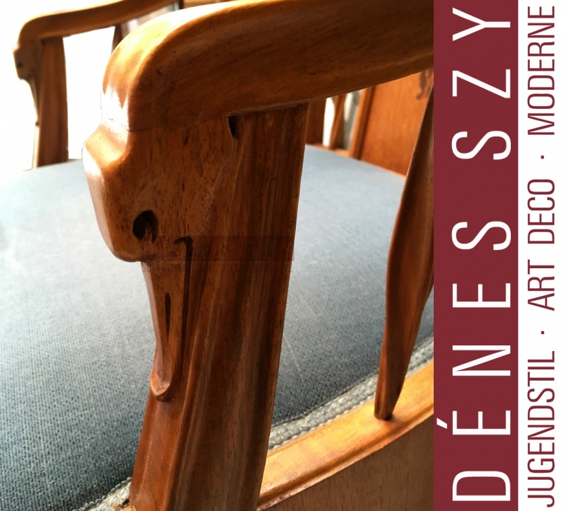 Louis Majorelle, Mahogany, nutwood and fruitwood, polished and with inlays. Upholstered. The backrest with twig-shaped inlays. Height 108cm, height of the seat approx. 46cm.